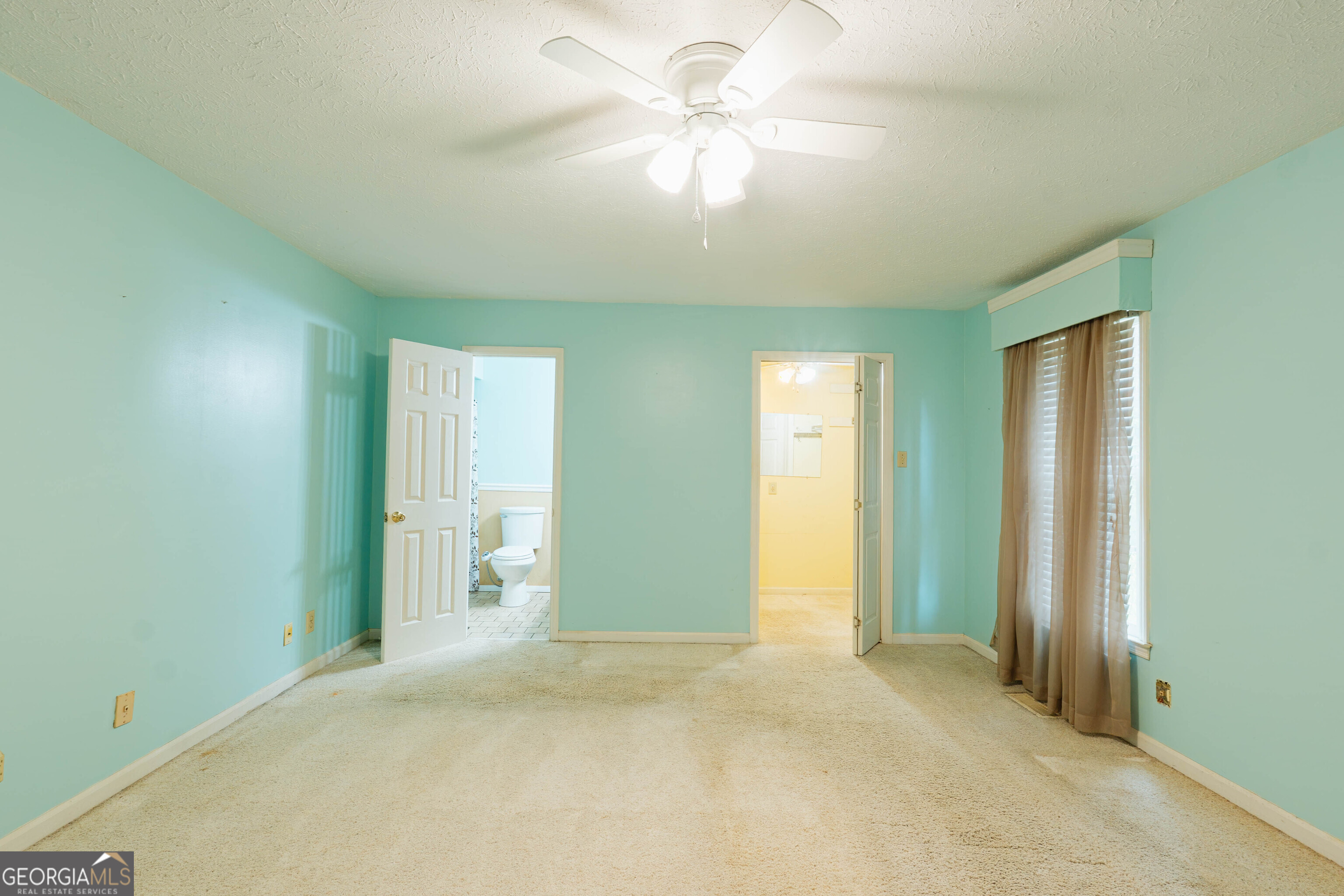 139 Cords Bridge Road Northeast Milledgeville, GA 31061 - Photo 15 of 35 an empty room with closet and a chandelier fan