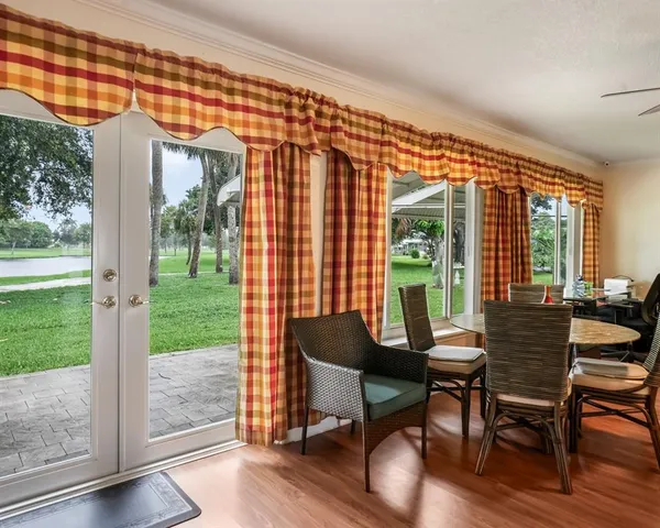 a balcony view with a outdoor seating space and a garden