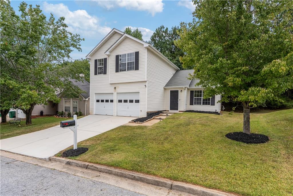 4883 Creekside Place Decatur, GA 30035 - Photo 1 of 1 a view of an house with backyard space and tree