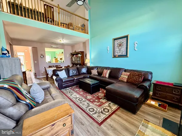 a living room with furniture fireplace and a flat screen tv