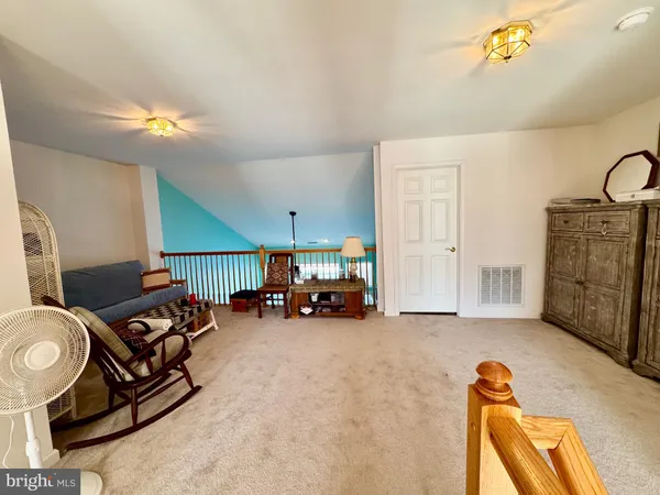 a view of walk in closet with clothes