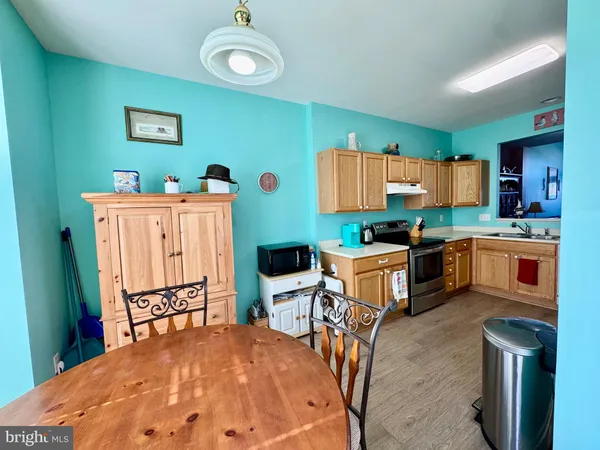 a kitchen that has a sink and a stove in it
