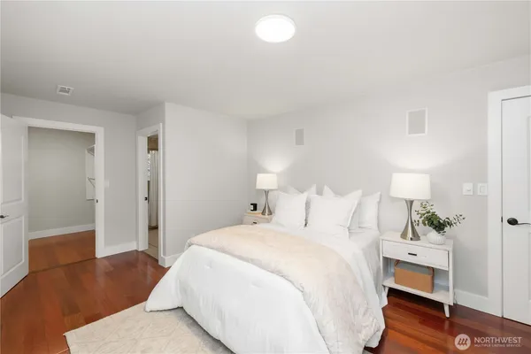 a bedroom with bed and a window