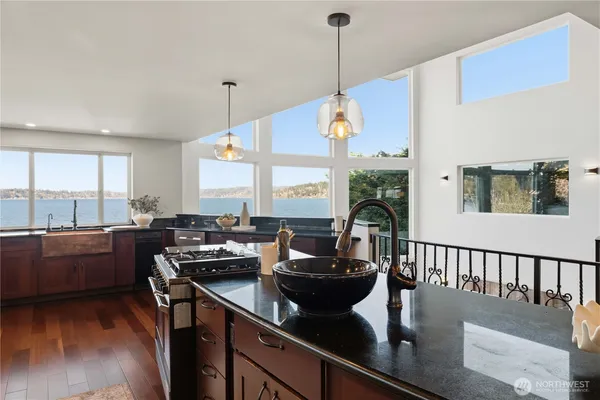 a kitchen with stainless steel appliances granite countertop a stove and a refrigerator