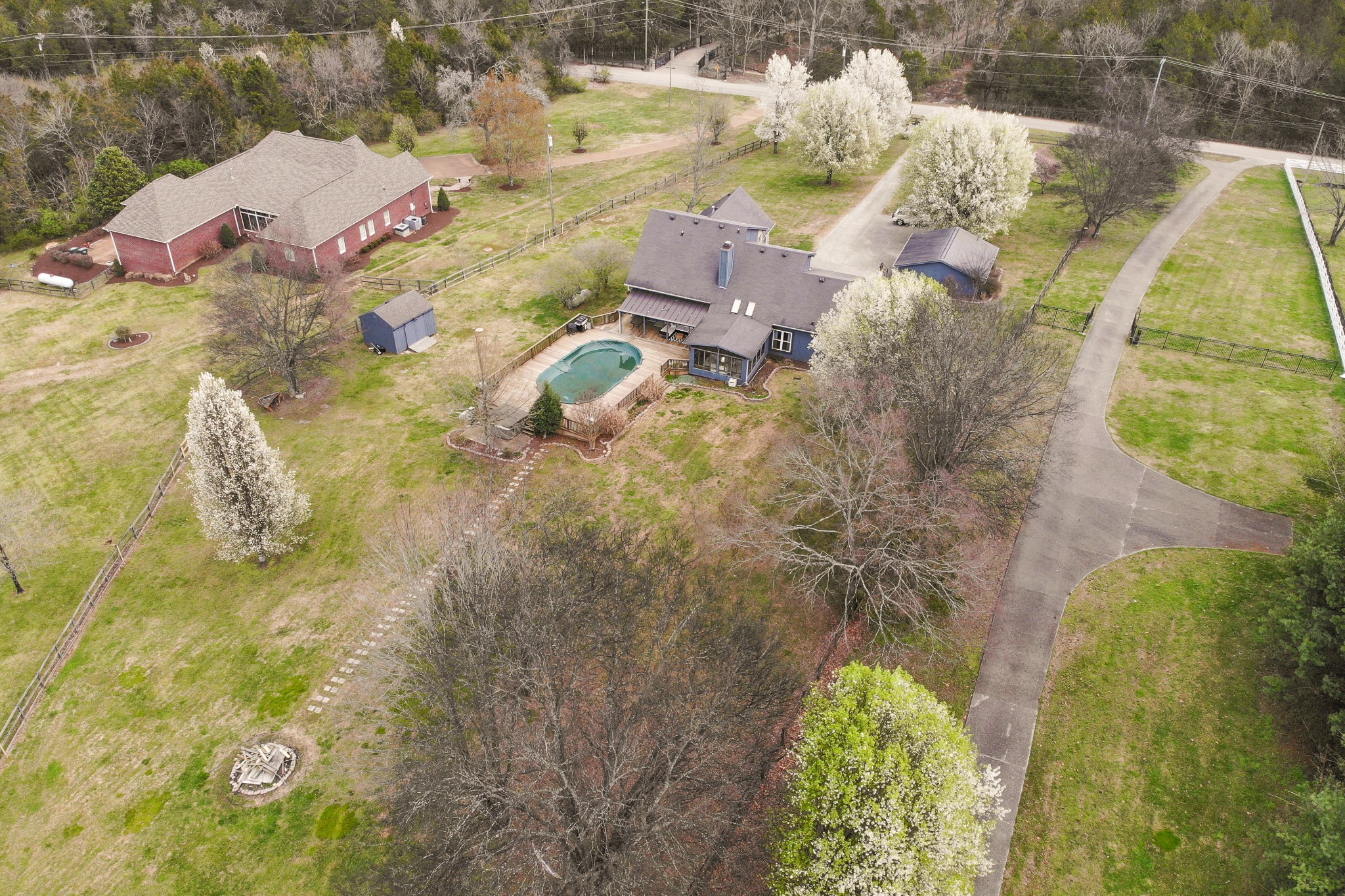 5871 Cane Ridge Road Antioch, TN 37013 - Photo 2 of 40 a aerial view of a house with swimming pool and large trees