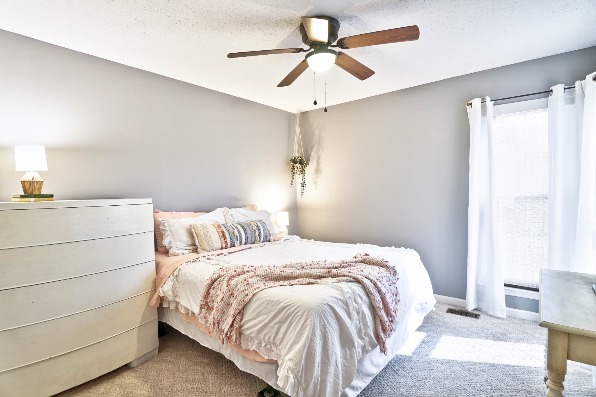 5871 Cane Ridge Road Antioch, TN 37013 - Photo 22 of 40 a bedroom with a bed and a chandelier