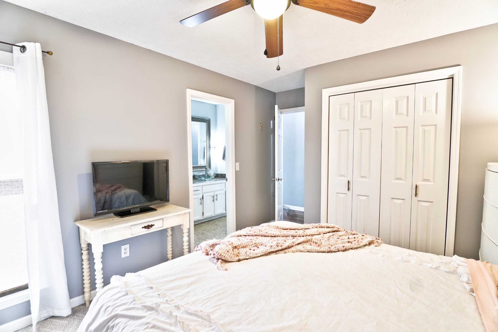 5871 Cane Ridge Road Antioch, TN 37013 - Photo 23 of 40 a bedroom with a bed and a flat screen tv