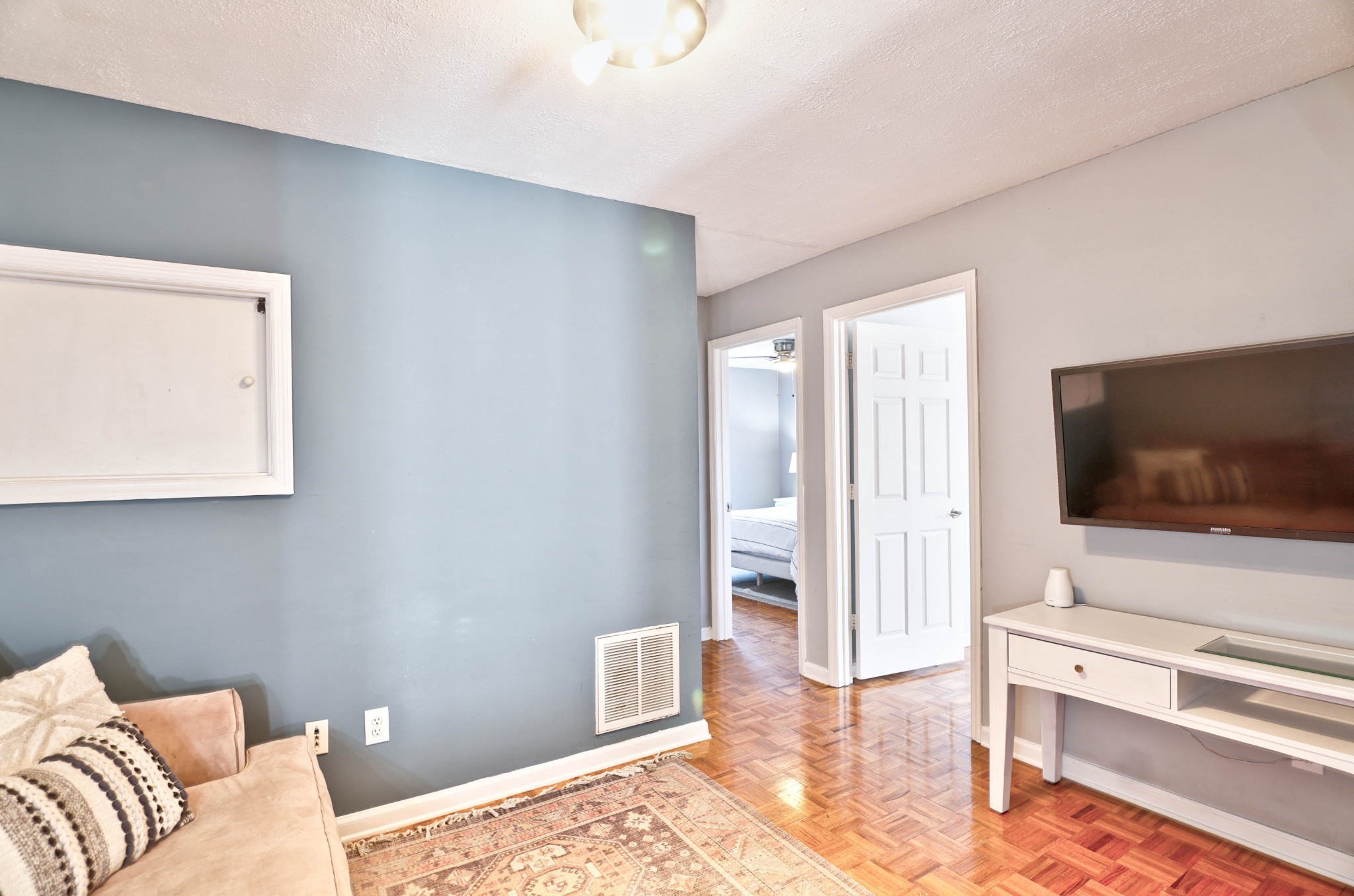 5871 Cane Ridge Road Antioch, TN 37013 - Photo 28 of 40 a living room with furniture and a flat screen tv