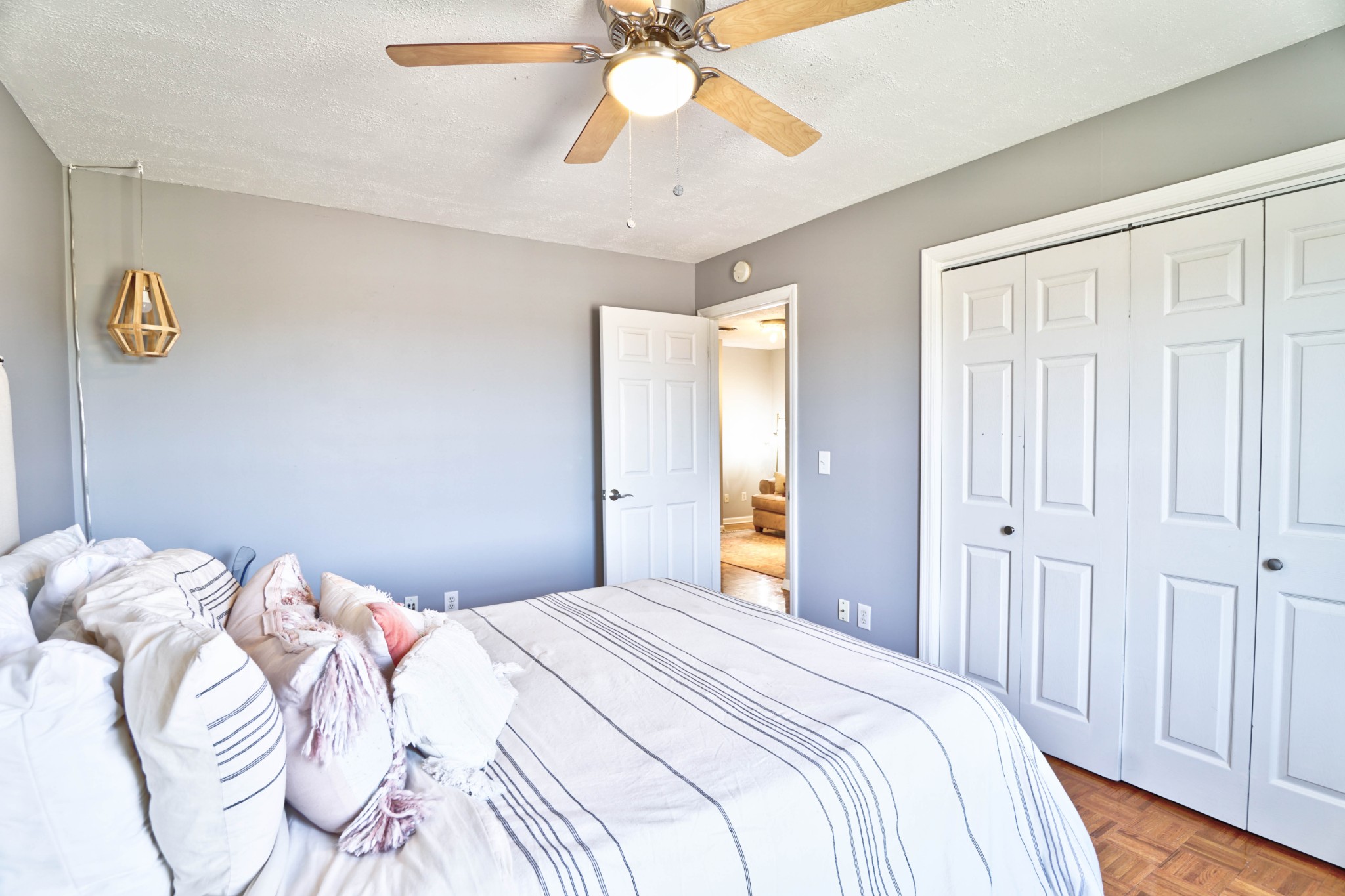 5871 Cane Ridge Road Antioch, TN 37013 - Photo 31 of 40 a bedroom with a bed and a chandelier