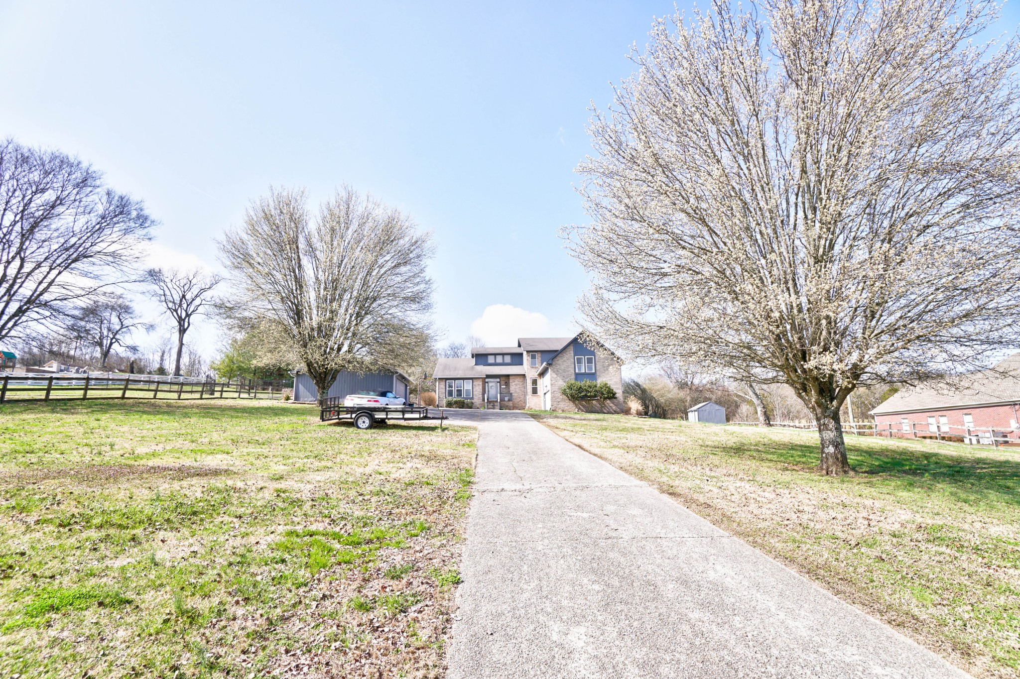 5871 Cane Ridge Road Antioch, TN 37013 - Photo 4 of 40 a view of a yard with a fountain and large trees