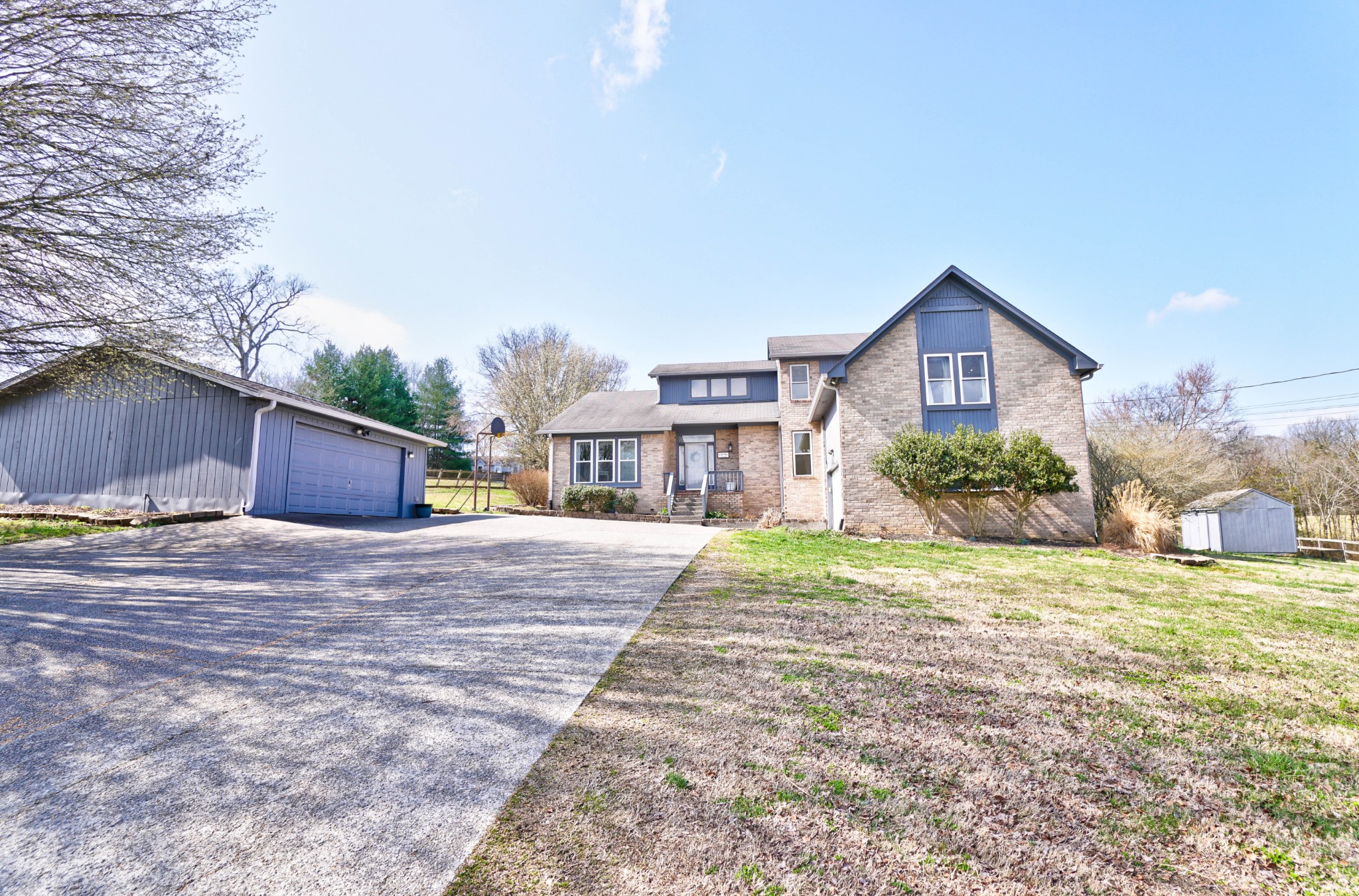 5871 Cane Ridge Road Antioch, TN 37013 - Photo 5 of 40 a front view of a house with a yard and garage