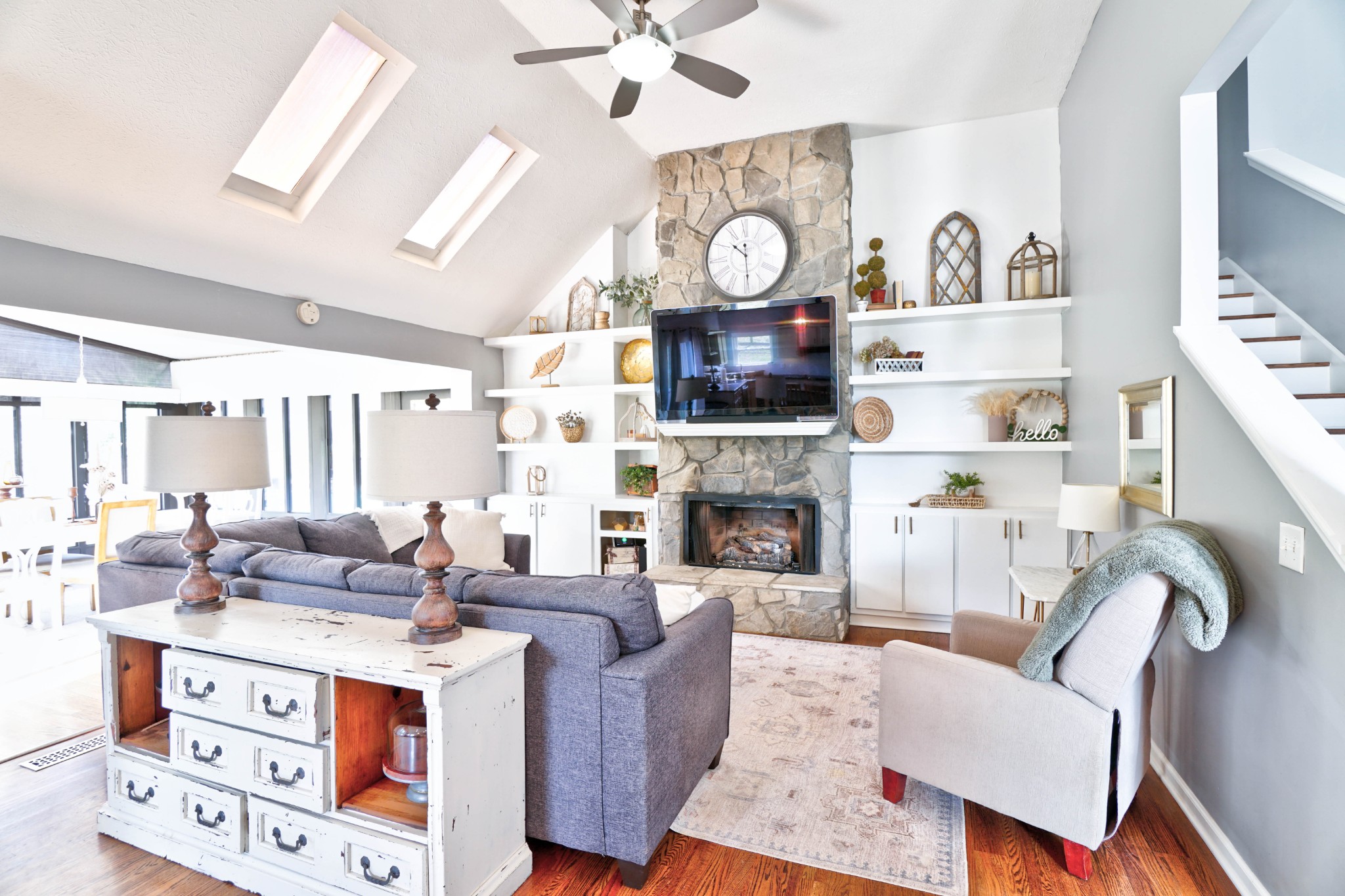 5871 Cane Ridge Road Antioch, TN 37013 - Photo 7 of 40 a living room with furniture a fireplace and a flat screen tv