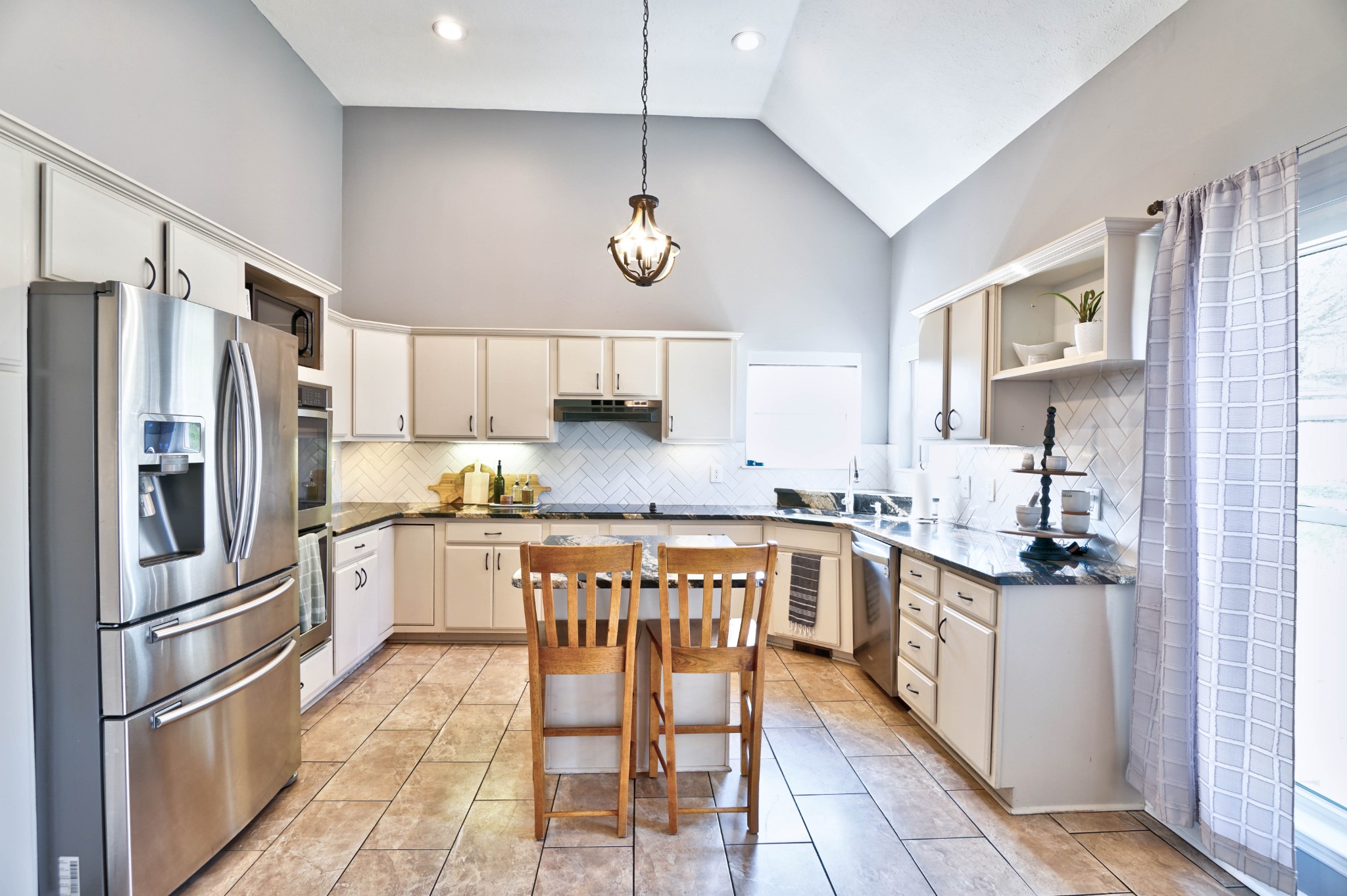 5871 Cane Ridge Road Antioch, TN 37013 - Photo 10 of 40 a kitchen with stainless steel appliances granite countertop a refrigerator a stove a sink and a refrigerator