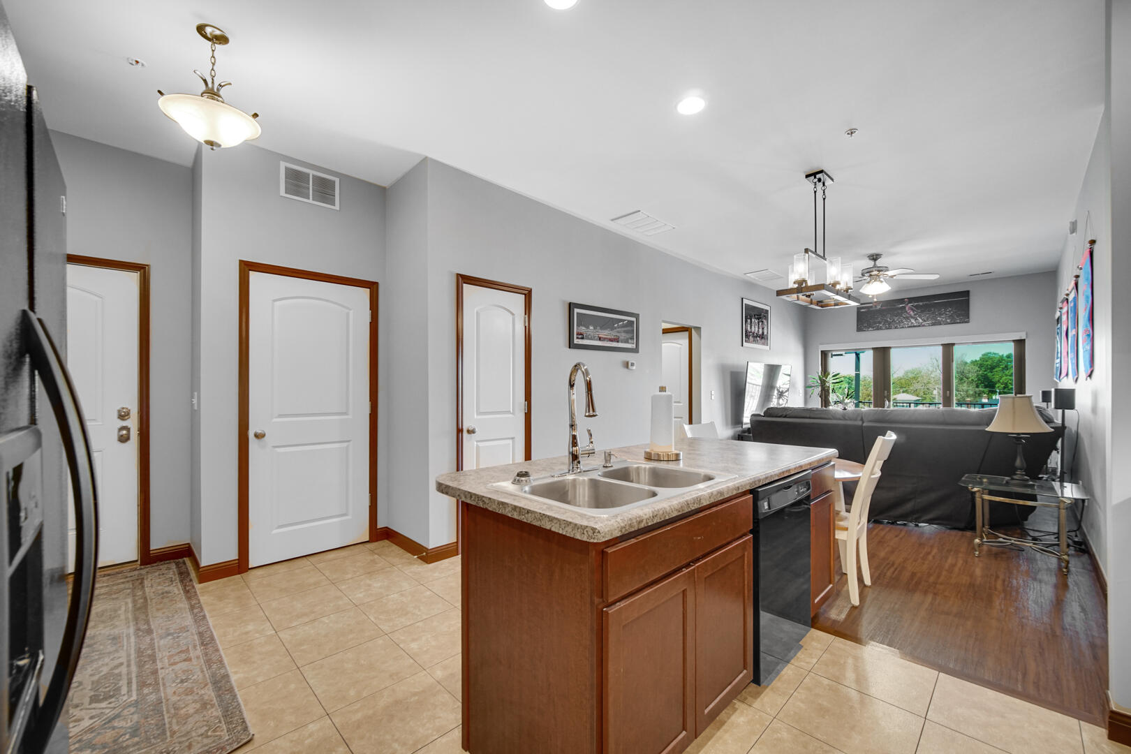 123 North Main Street, Unit 301 Crown Point, IN 46307 - Photo 7 of 25 a dining hall with granite countertop a stove a sink a dining table and chairs