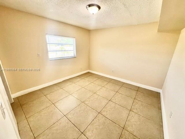 685 Northeast 85th Street, Unit 8 Miami, FL 33138 - Photo 5 of 6 a view of a room with white walls