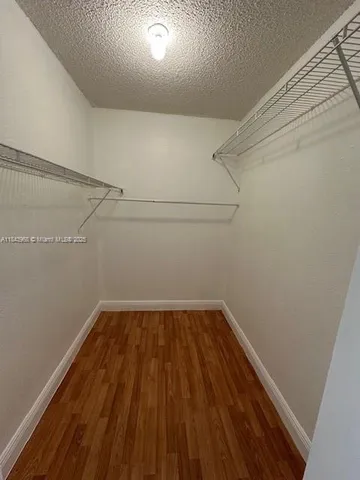 a view of a room with racks on the wall