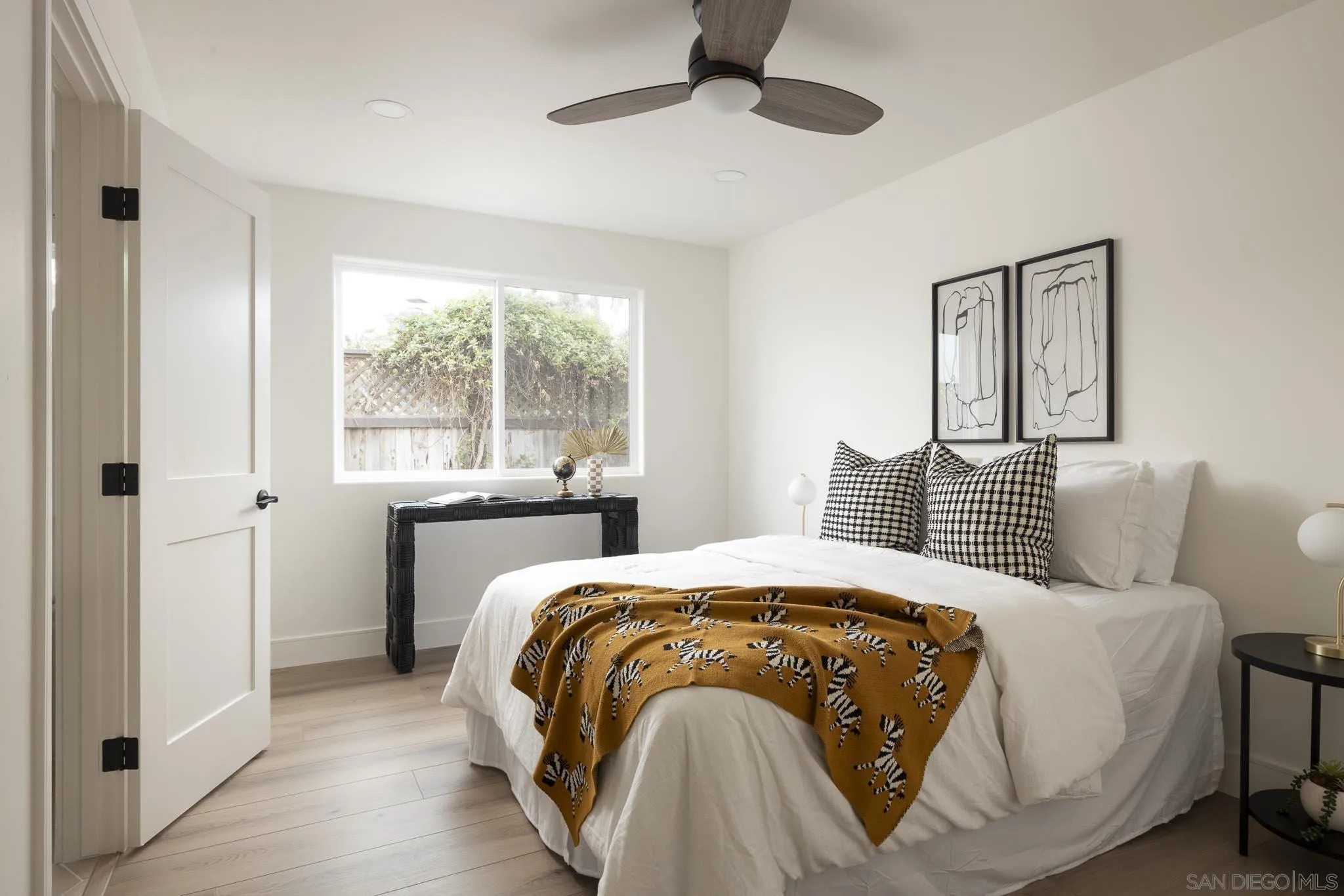 614 Ezee Street Encinitas, CA 92024 - Photo 17 of 41 a bedroom with a bed and a window