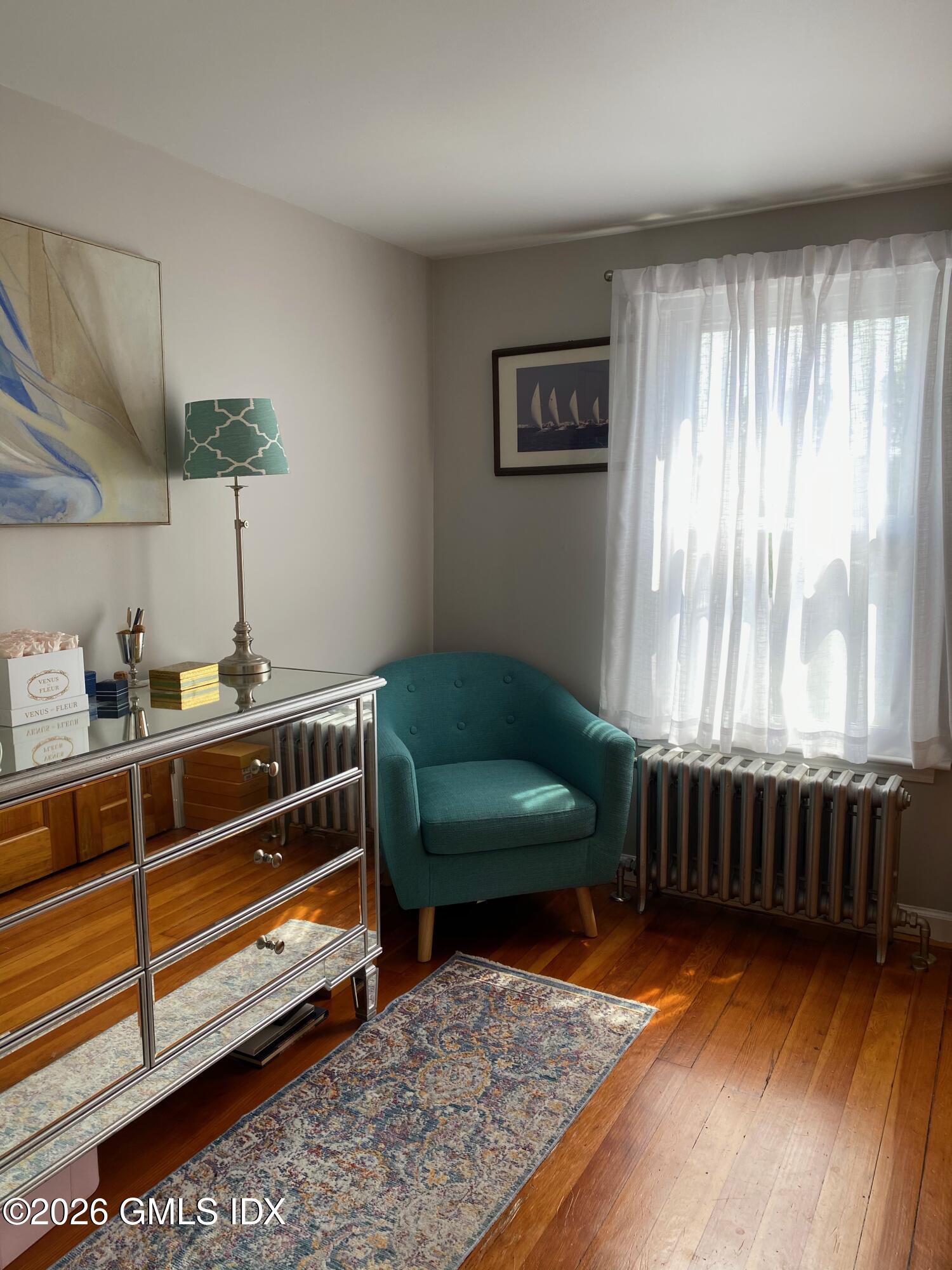 22 Division Street Greenwich, CT 06830 - Photo 17 of 29 a living room with furniture and a window