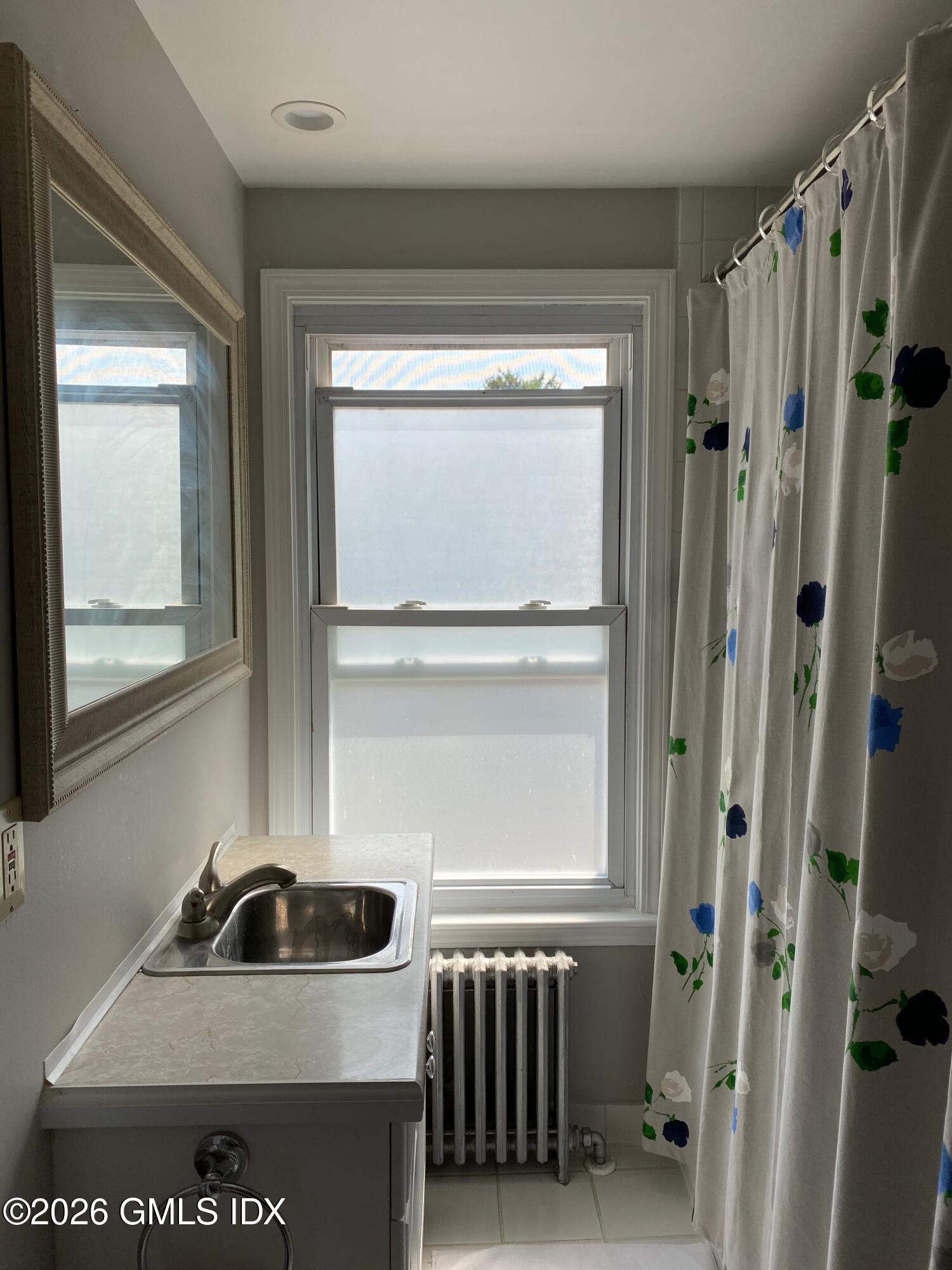 22 Division Street Greenwich, CT 06830 - Photo 25 of 29 a kitchen with a refrigerator and a sink