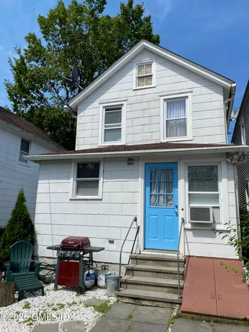 a front view of a house with parking