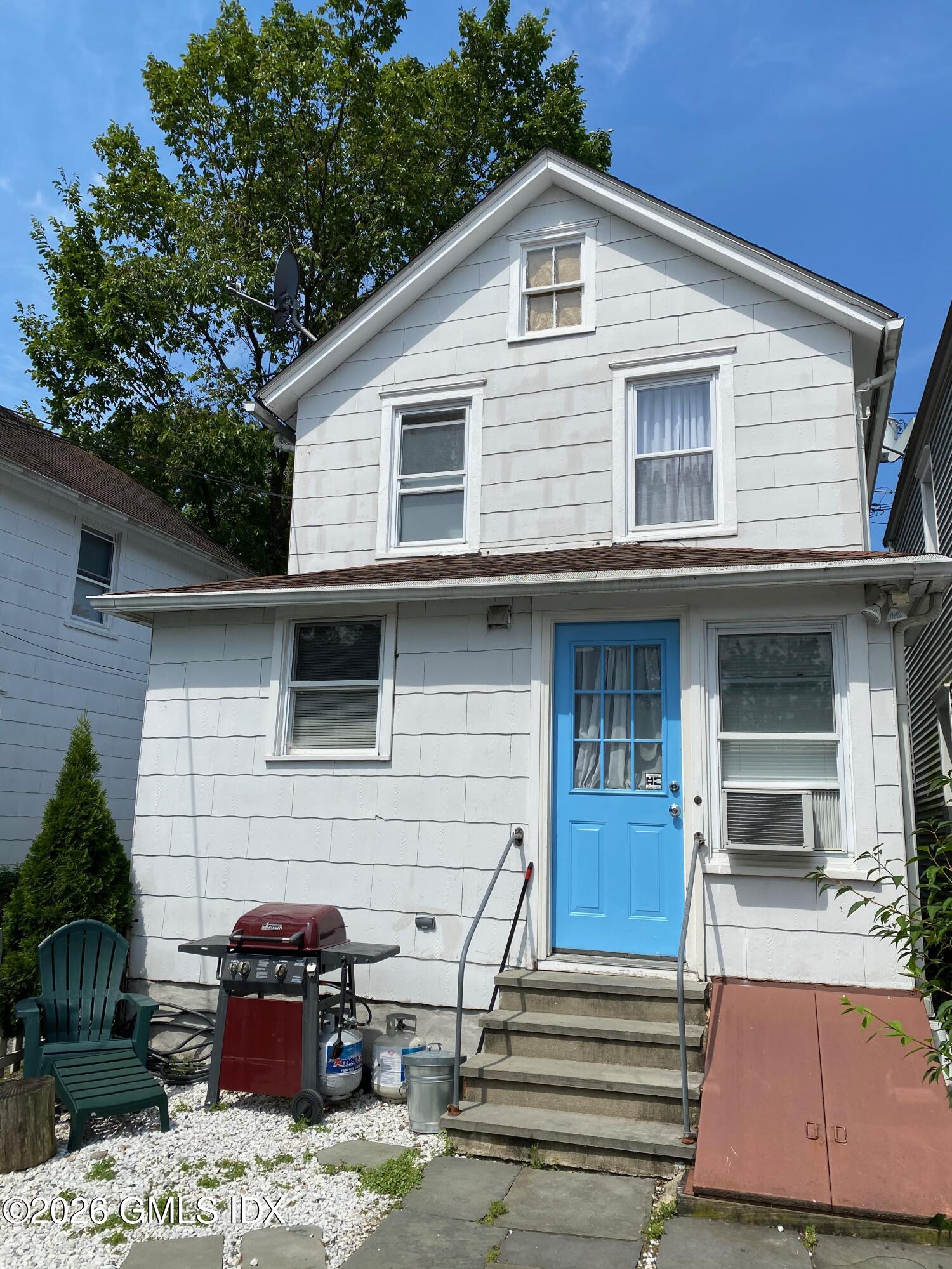 22 Division Street Greenwich, CT 06830 - Photo 28 of 29 a front view of a house with parking