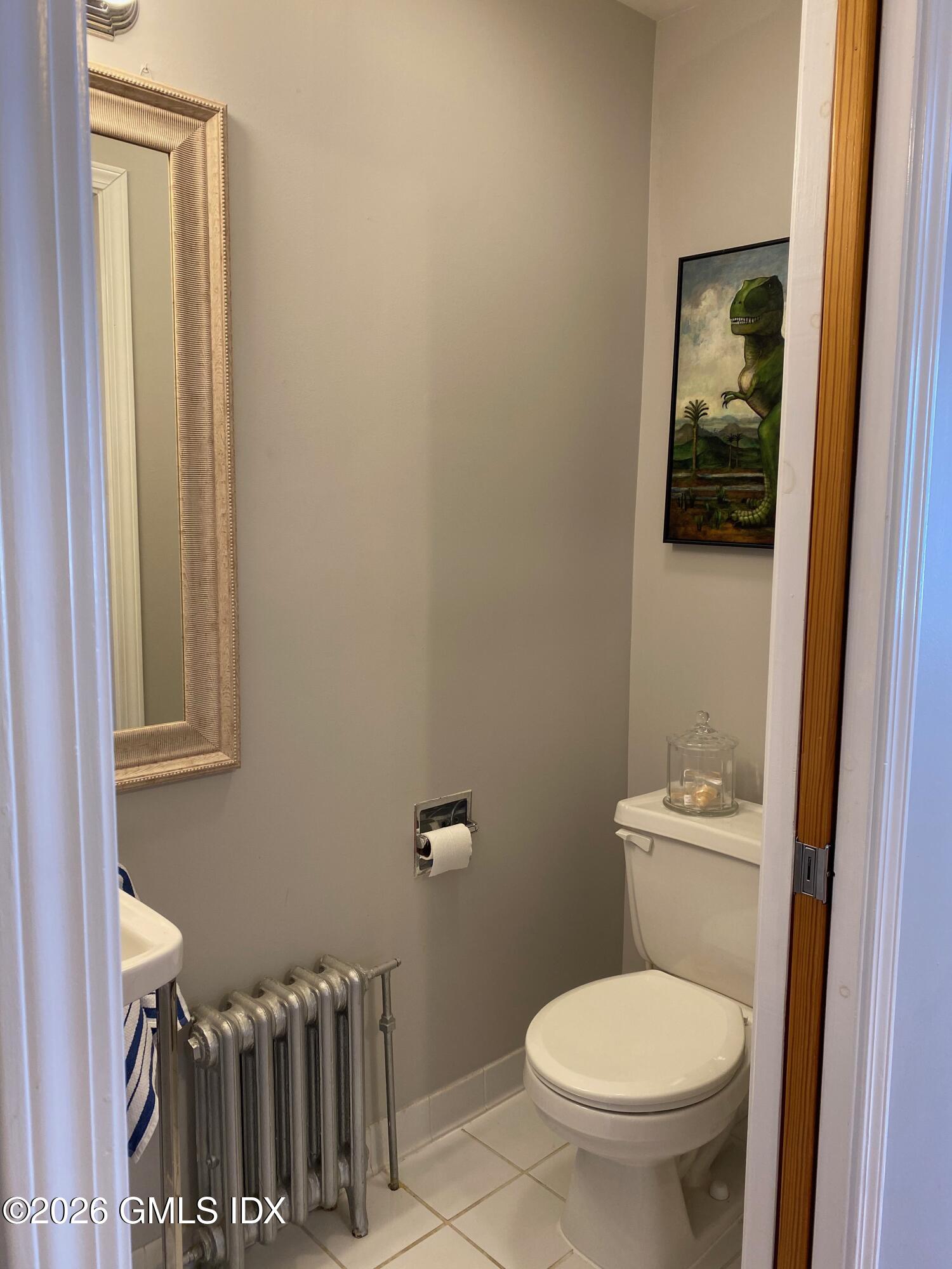 22 Division Street Greenwich, CT 06830 - Photo 8 of 29 a white toilet sitting next to a small bathroom