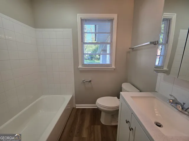 a bathroom with a sink toilet and bathtub
