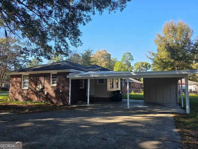 a front view of house with yard outdoor seating and green space