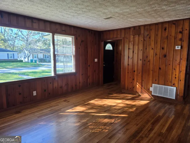 a view of outdoor space and wooden floor
