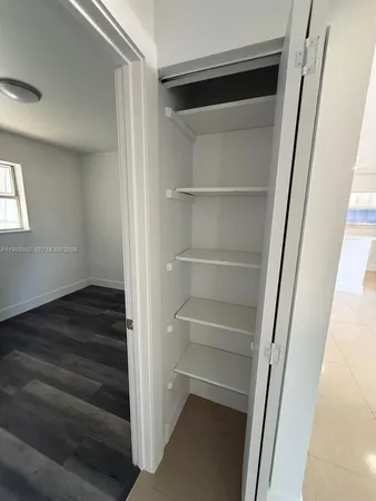a view of an empty walk in closet