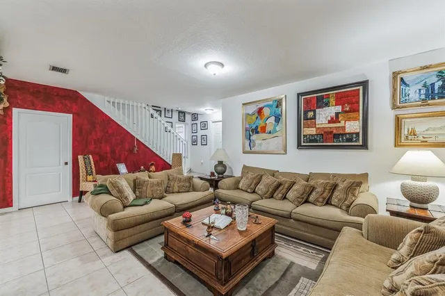 a living room with furniture and a couch