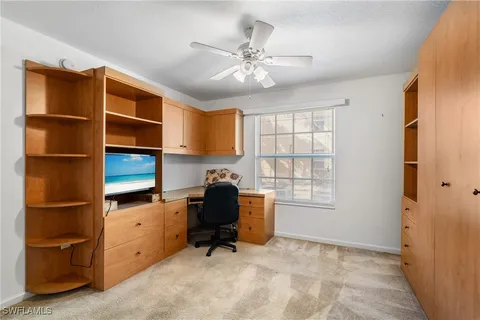a view of workspace with a window and cabinet