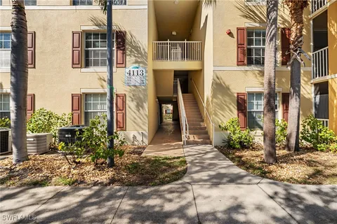a front view of a building with a yard
