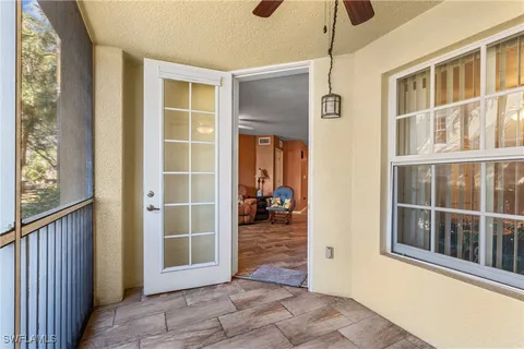 a view of a livingroom with wooden floor and a window