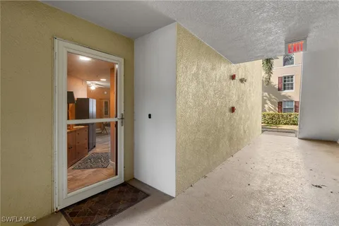 a view of a bathroom with a glass door and shower