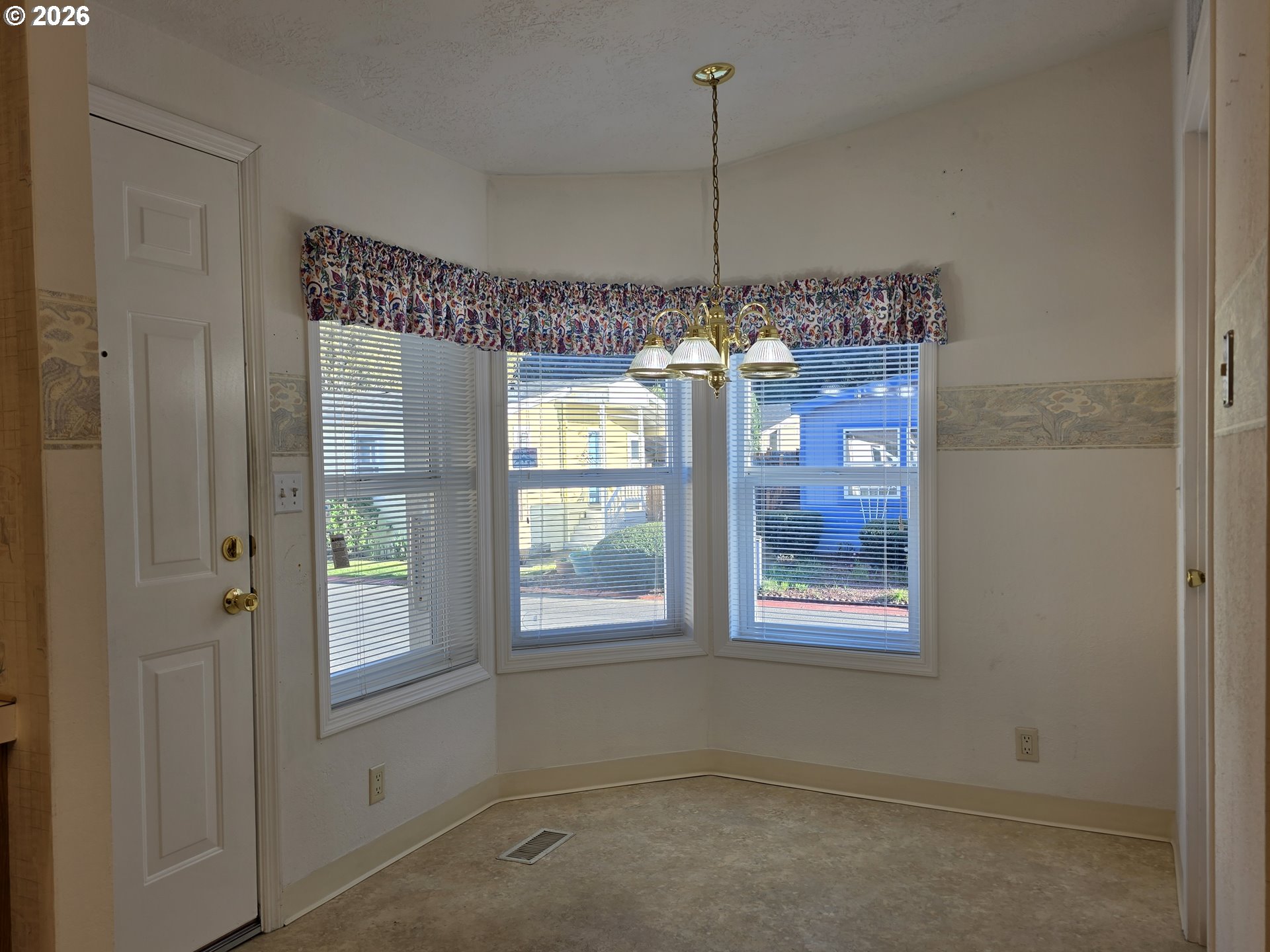 15768 Southeast Powell Boulevard, Unit 28 Portland, OR 97236 - Photo 11 of 42 a view of an empty room with a window