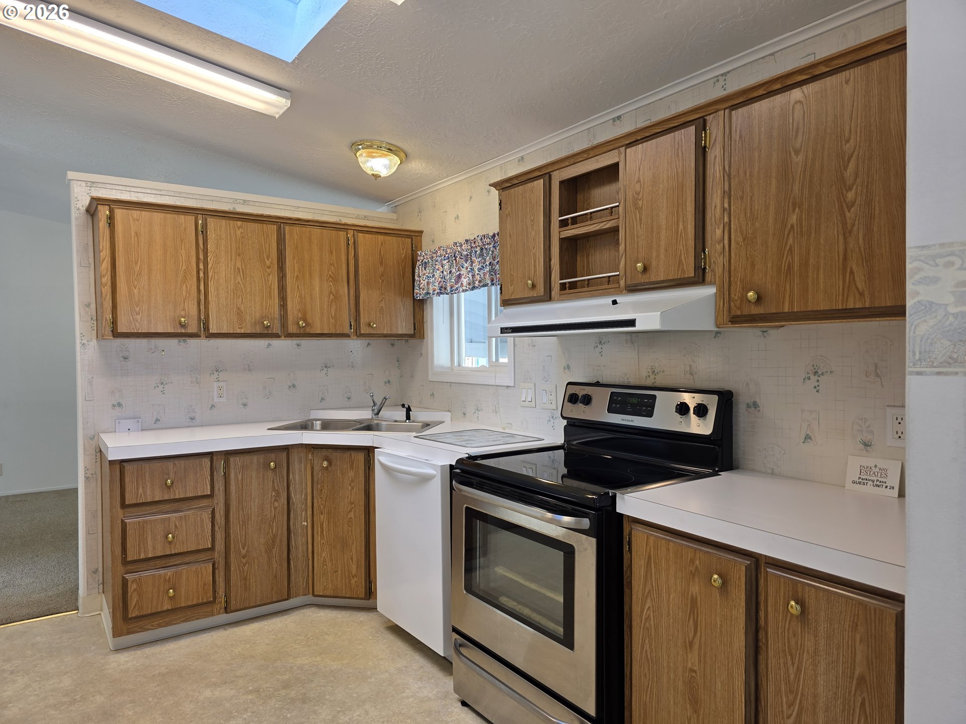 15768 Southeast Powell Boulevard, Unit 28 Portland, OR 97236 - Photo 12 of 42 a kitchen with a sink stove and microwave