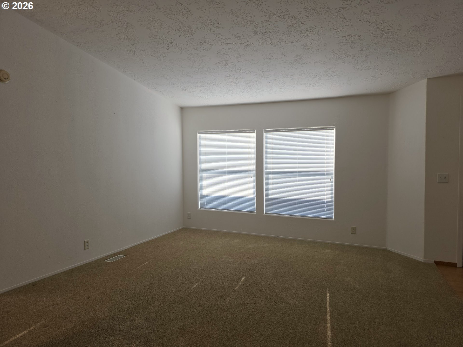 15768 Southeast Powell Boulevard, Unit 28 Portland, OR 97236 - Photo 23 of 42 an empty room with a window