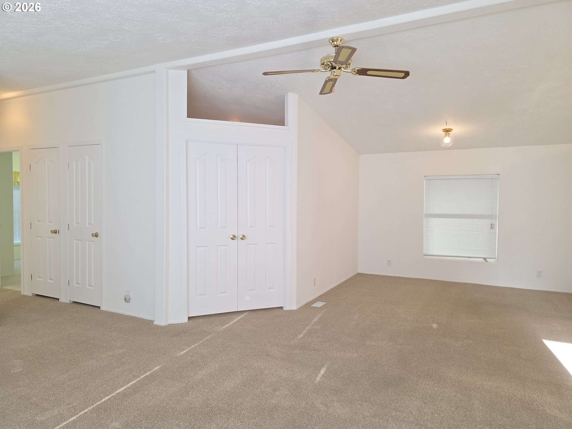 15768 Southeast Powell Boulevard, Unit 28 Portland, OR 97236 - Photo 26 of 42 a view of a room with stairs and a ceiling fan