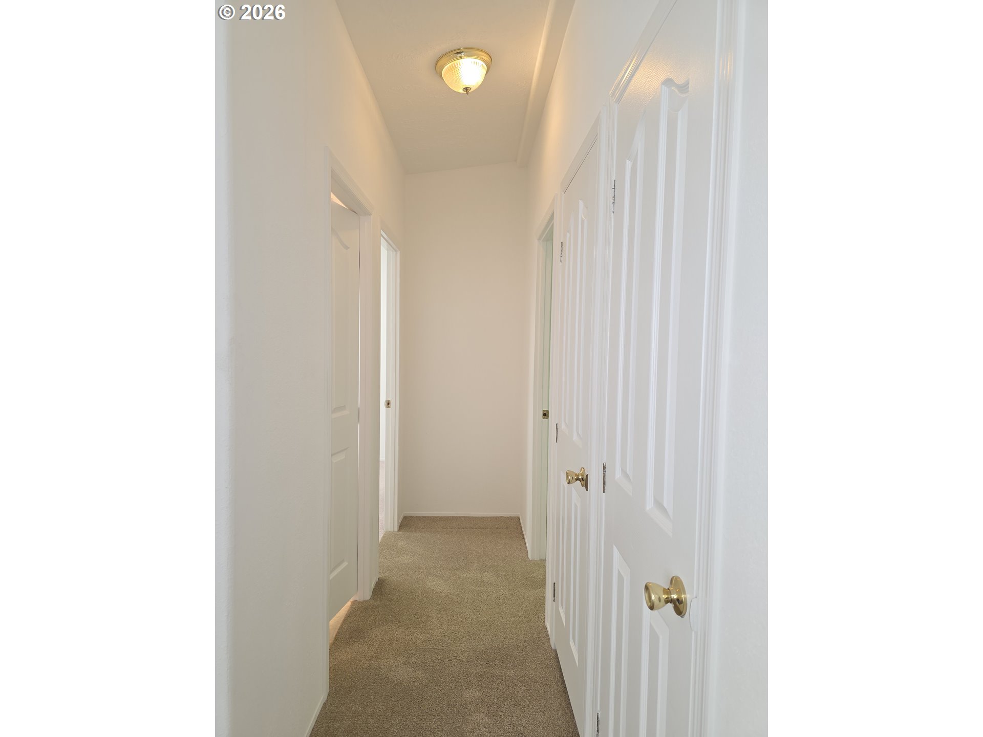 15768 Southeast Powell Boulevard, Unit 28 Portland, OR 97236 - Photo 27 of 42 a view of a hallway with closet