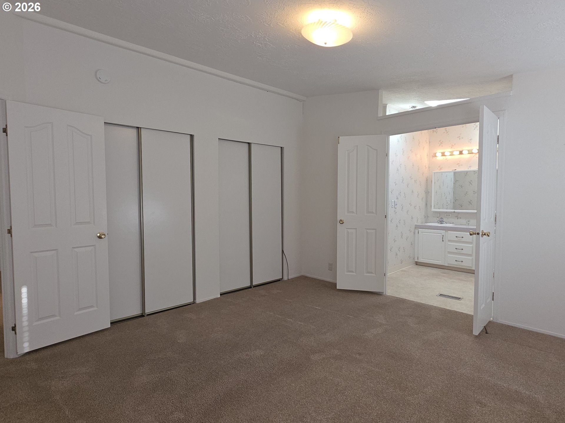 15768 Southeast Powell Boulevard, Unit 28 Portland, OR 97236 - Photo 29 of 42 an empty room with closet area