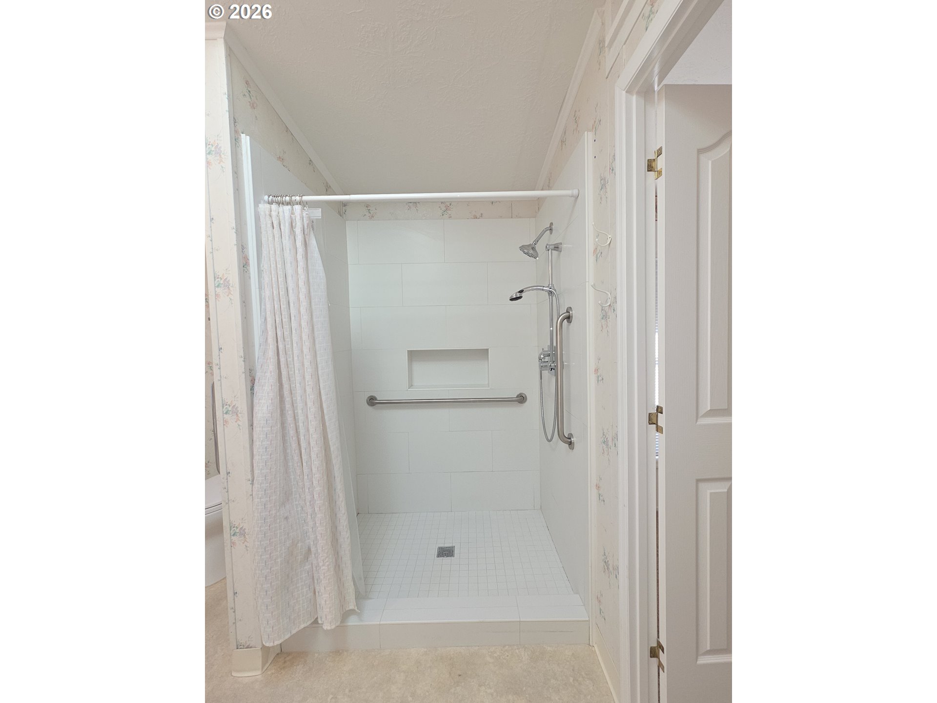 15768 Southeast Powell Boulevard, Unit 28 Portland, OR 97236 - Photo 32 of 42 a bathroom with a glass shower door