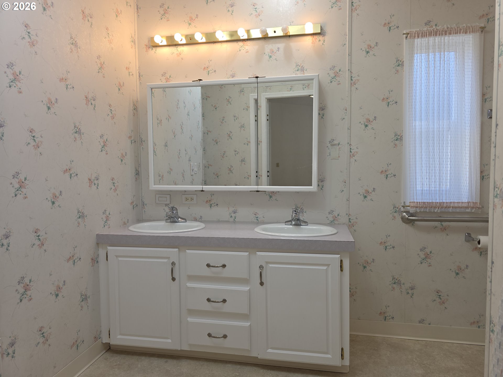 15768 Southeast Powell Boulevard, Unit 28 Portland, OR 97236 - Photo 34 of 42 a bathroom with a sink and a mirror
