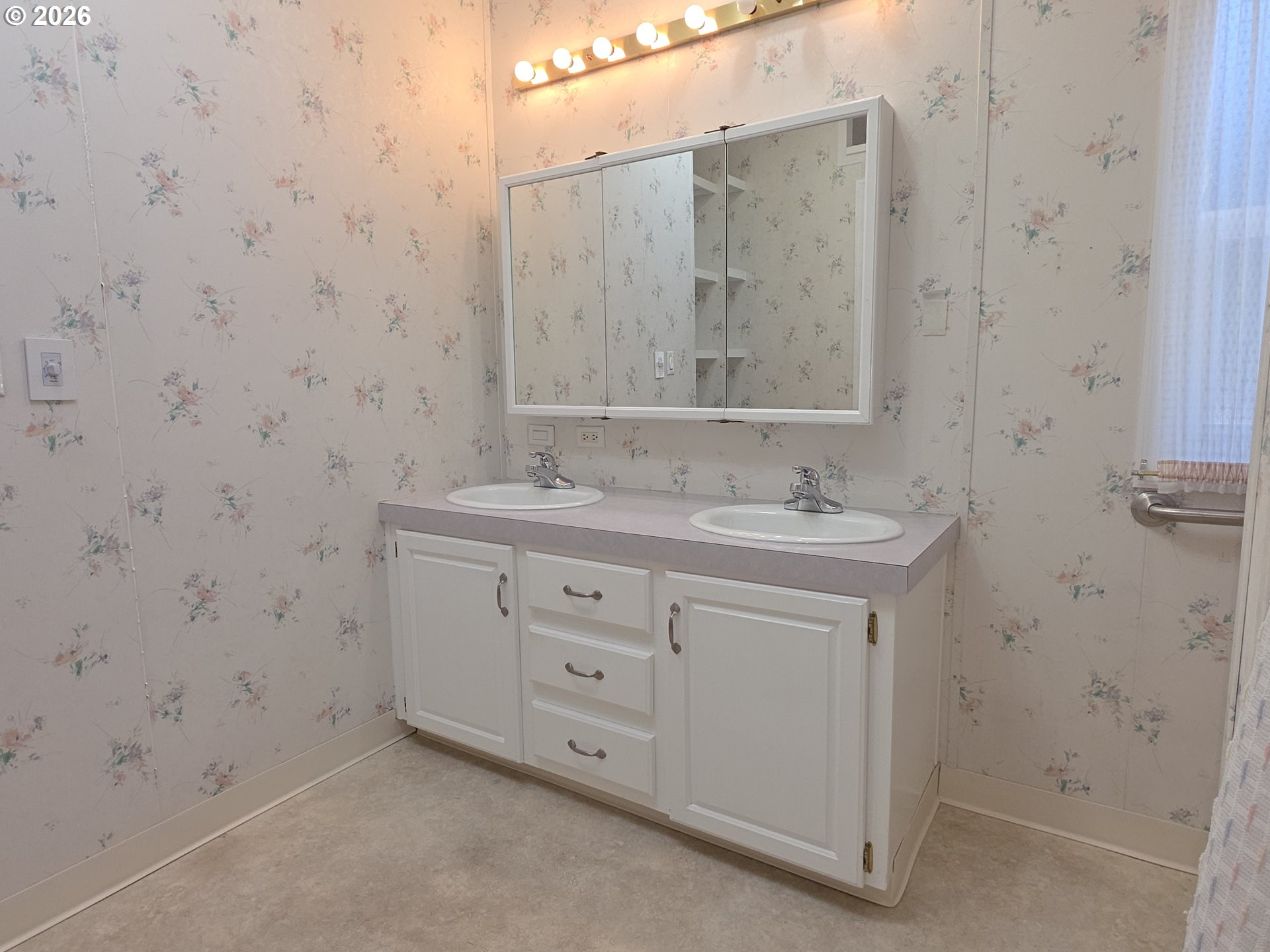 15768 Southeast Powell Boulevard, Unit 28 Portland, OR 97236 - Photo 35 of 42 a bathroom with a sink and a mirror