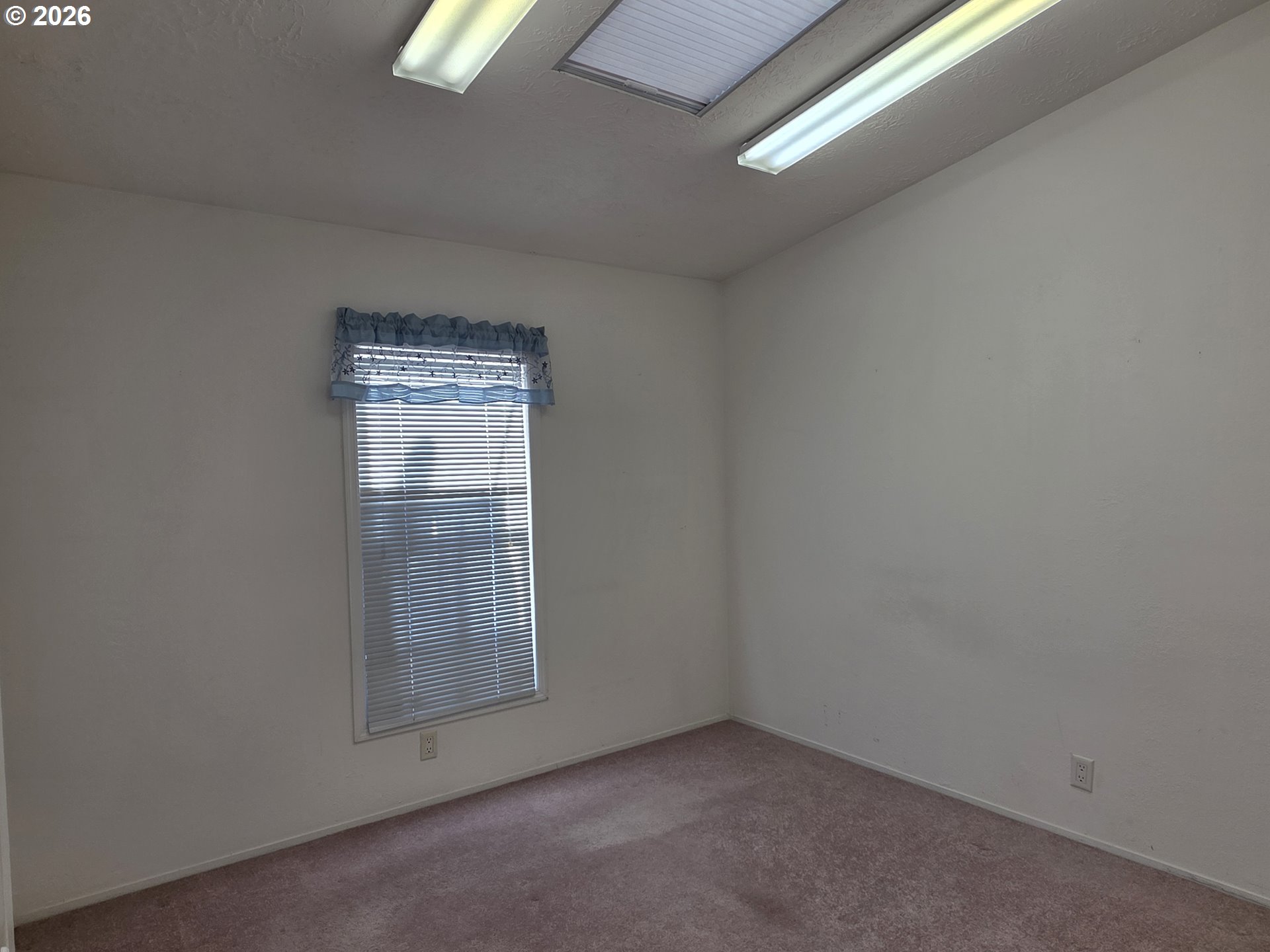 15768 Southeast Powell Boulevard, Unit 28 Portland, OR 97236 - Photo 37 of 42 a view of an empty room and window