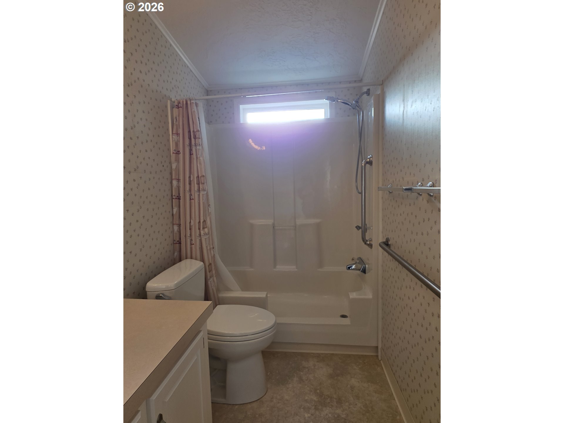 15768 Southeast Powell Boulevard, Unit 28 Portland, OR 97236 - Photo 38 of 42 a bathroom with a toilet a sink and shower