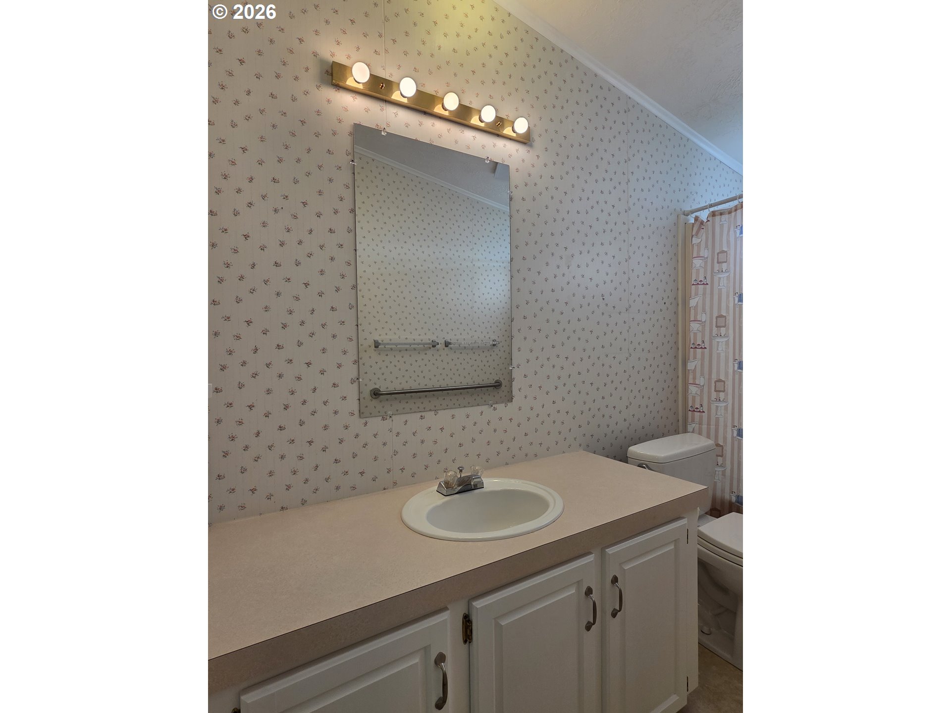 15768 Southeast Powell Boulevard, Unit 28 Portland, OR 97236 - Photo 41 of 42 a bathroom with a sink and a mirror
