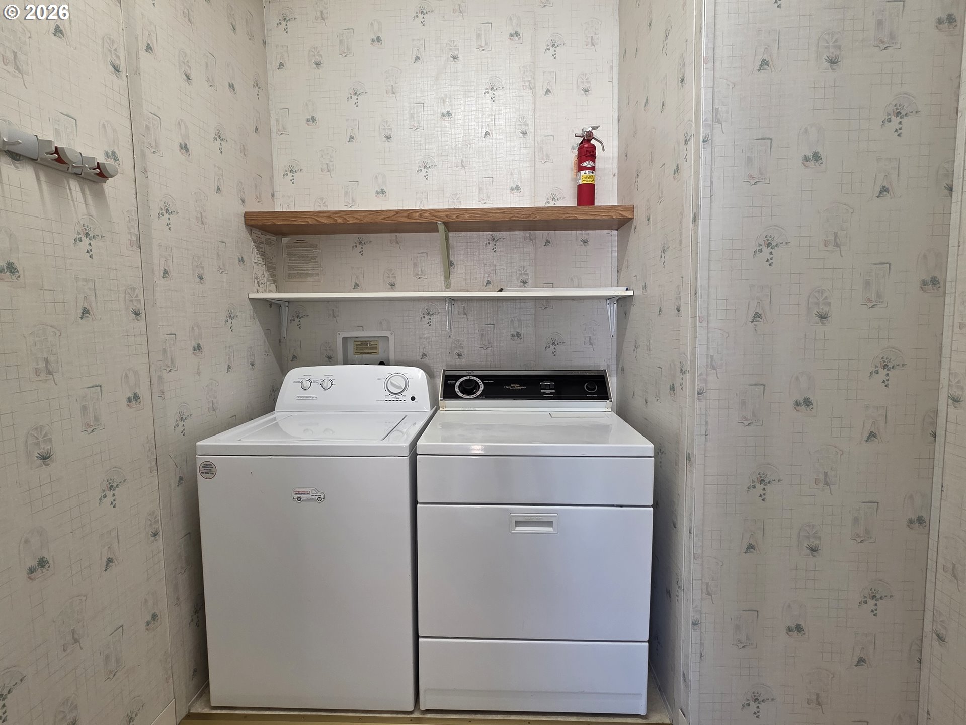 15768 Southeast Powell Boulevard, Unit 28 Portland, OR 97236 - Photo 42 of 42 a utility room with dryer and washer