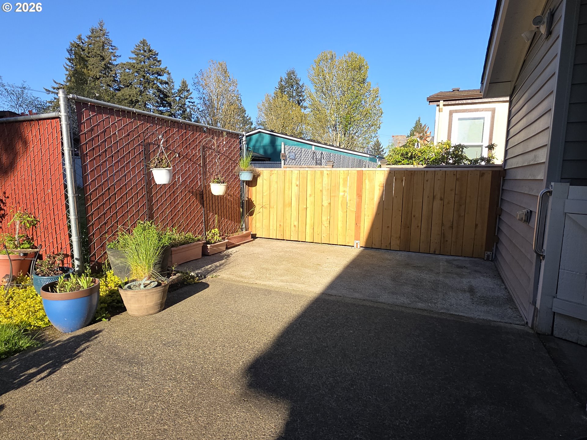 15768 Southeast Powell Boulevard, Unit 28 Portland, OR 97236 - Photo 9 of 42 a view of a house with a garage