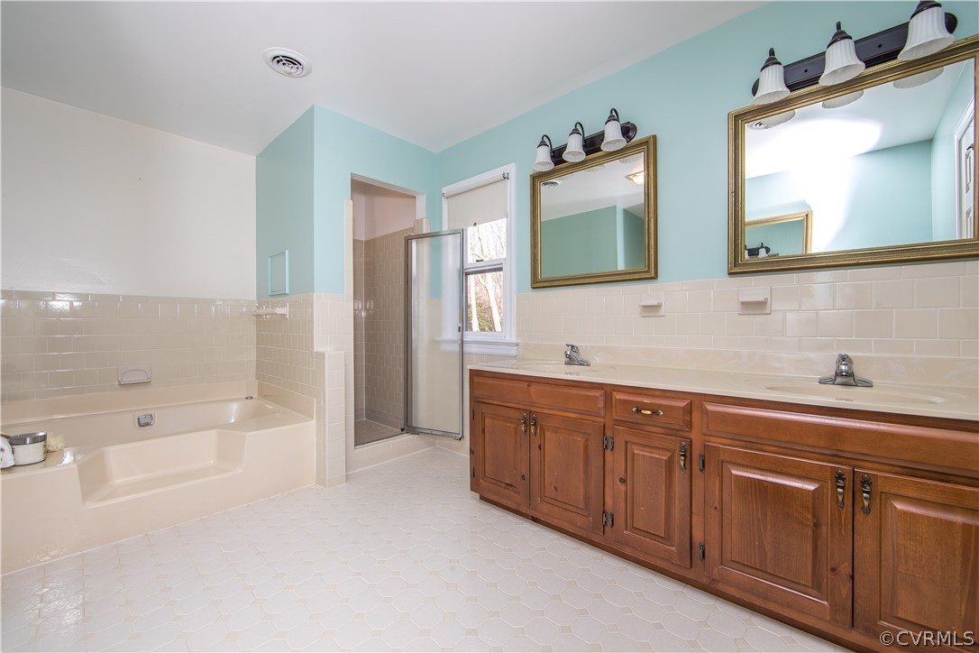 12905 Rivers Bend Road Chester, VA 23836 - Photo 17 of 27 Love all this space in the primary bathroom!